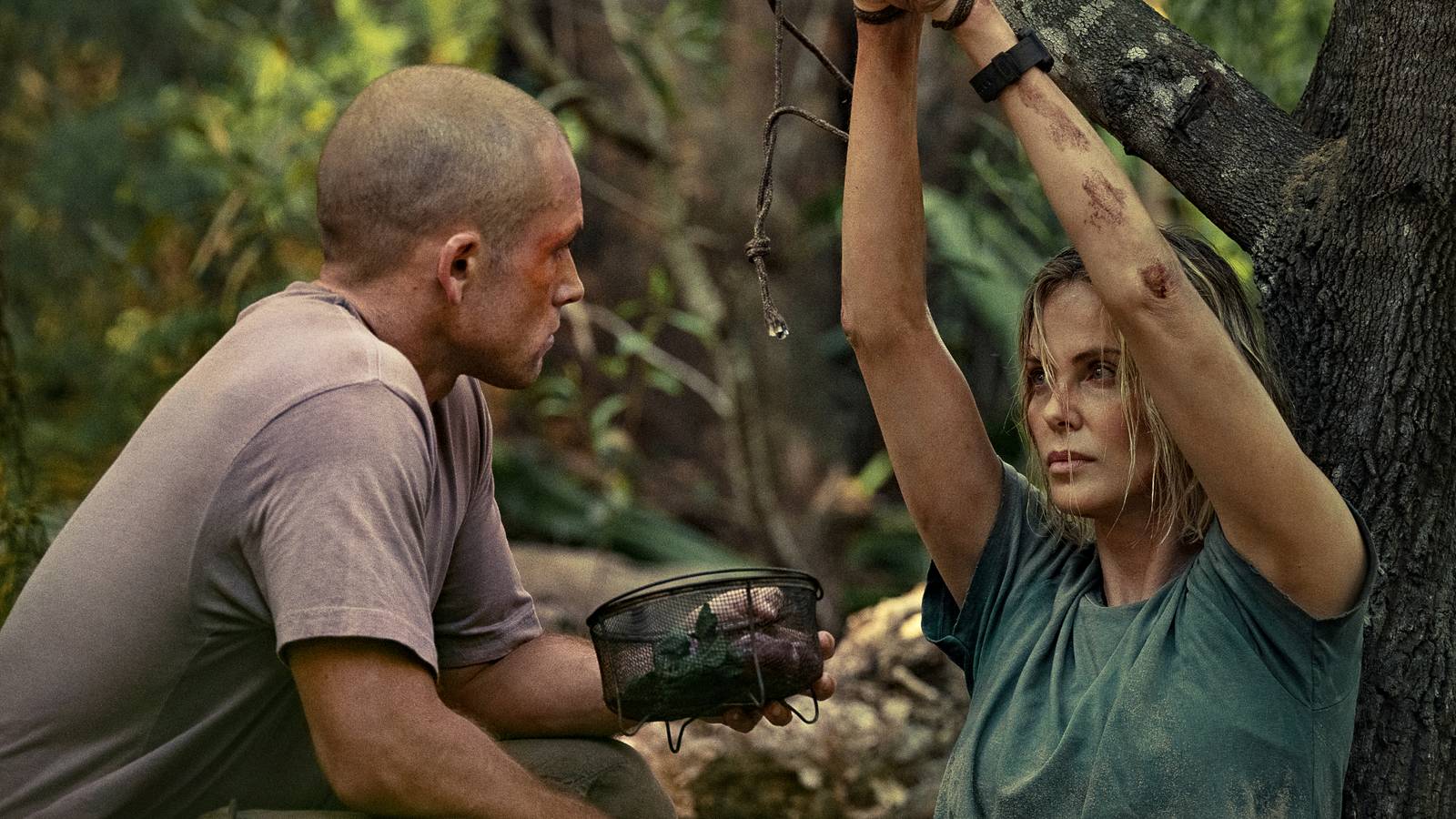 Taron Egerton & Charlize Theron Face Off in Netflix's Survival Thriller 'Apex' This Month